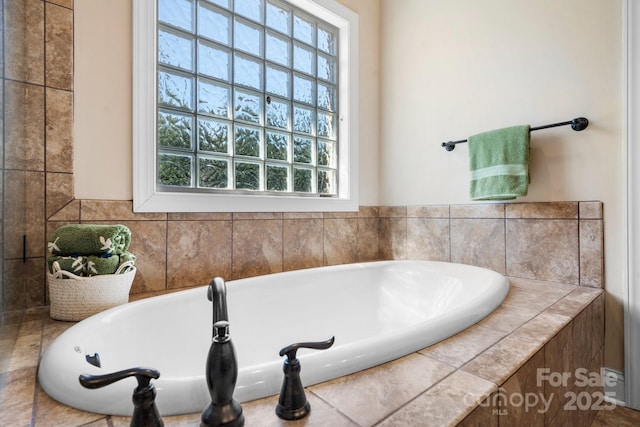 bathroom with a tub to relax in