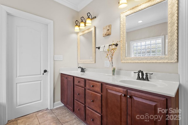 bathroom featuring double vanity, ornamental molding, tile patterned floors, and a sink