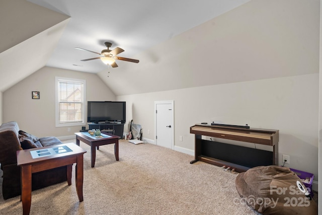 living room featuring baseboards, carpet floors, lofted ceiling, and a ceiling fan