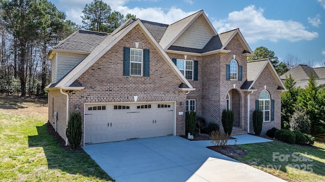 3815 10th St NE, Hickory, NC 28601 - traditional home featuring a front lawn, driveway, brick siding, and roof with shingles