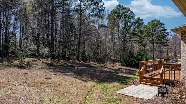 3815 10th St NE, Hickory, NC 28601 - view of yard with a deck and a forest view