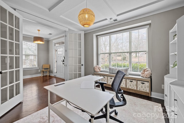 office space featuring a wealth of natural light, visible vents, baseboards, and dark wood-style flooring