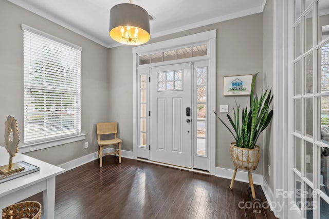 entrance foyer with crown molding, baseboards, and dark wood-style flooring