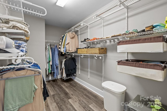 spacious closet with wood finished floors