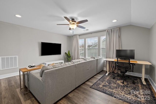 living area with visible vents, ceiling fan, baseboards, dark wood finished floors, and lofted ceiling