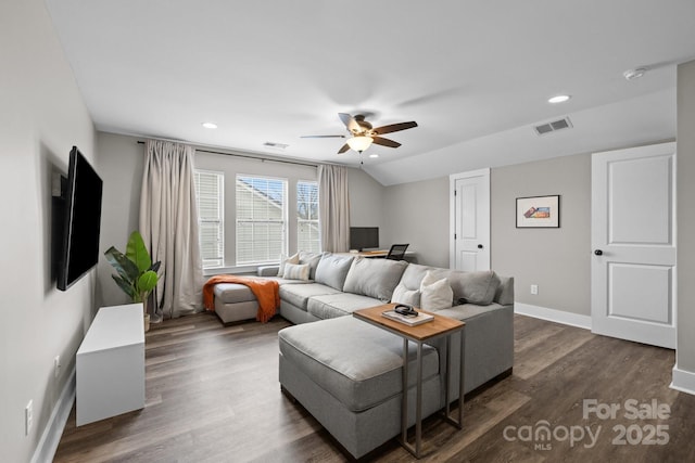 living room with visible vents, ceiling fan, baseboards, dark wood finished floors, and vaulted ceiling