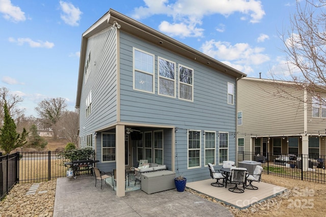 back of house featuring a fenced backyard and a patio area