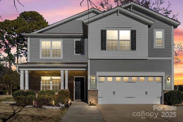 5703 Eleanor Rigby Rd, Charlotte, NC 28278 - view of front of house with a garage, brick siding, and driveway