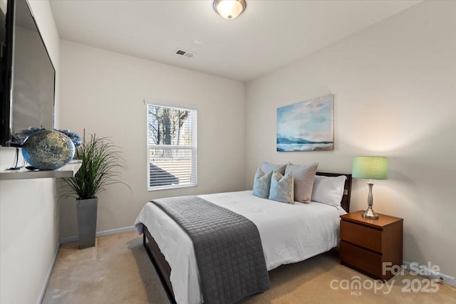 bedroom with visible vents, baseboards, and carpet flooring