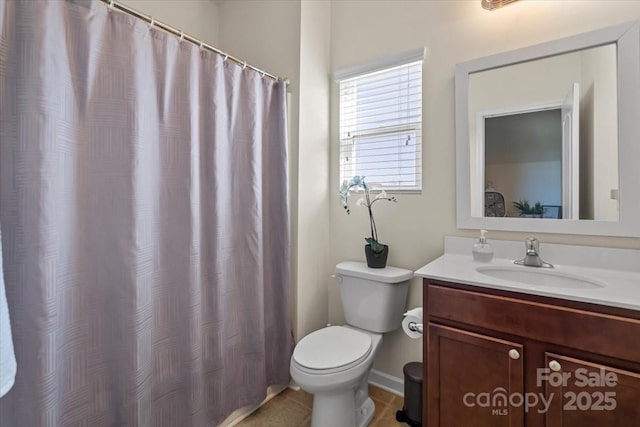 full bathroom featuring toilet and vanity