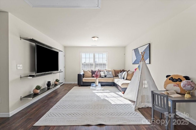 living room with wood finished floors and baseboards