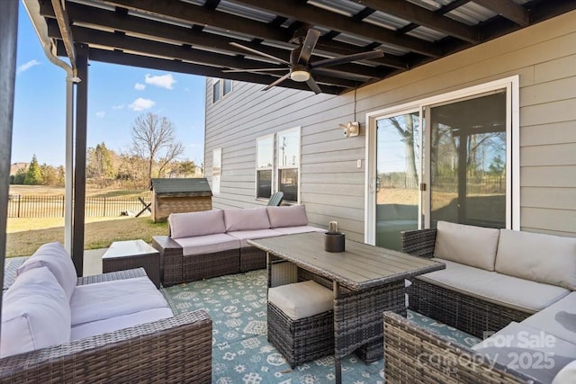 view of patio featuring an outdoor hangout area, ceiling fan, and fence