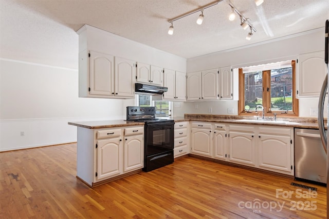 kitchen featuring electric range, a textured ceiling, under cabinet range hood, dishwasher, and a sink