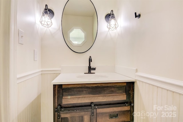 bathroom featuring vanity and wainscoting