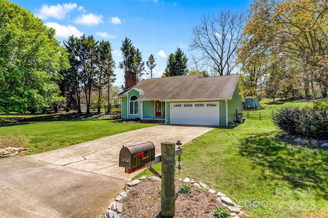 view of front of property with a chimney, an attached garage, a front lawn, and concrete driveway