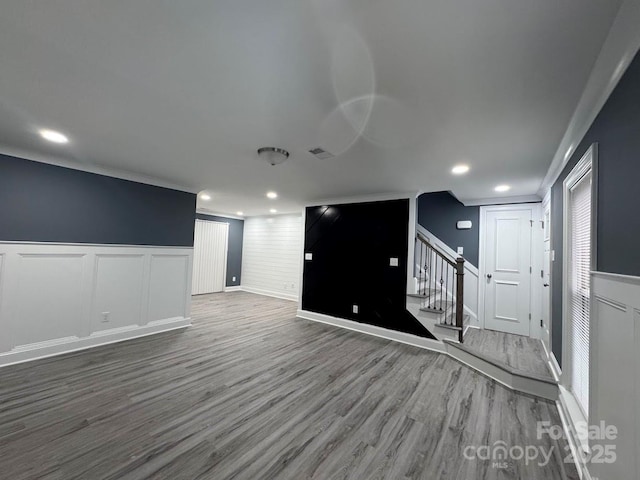 interior space featuring stairway, recessed lighting, and wood finished floors