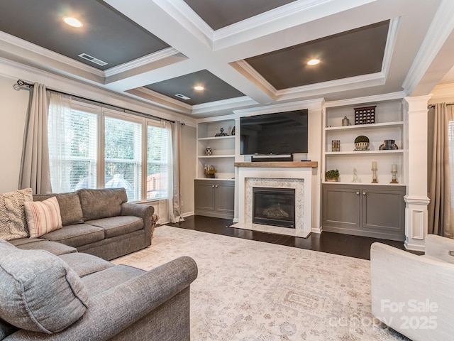 living area with visible vents, beamed ceiling, ornamental molding, dark wood-style floors, and coffered ceiling