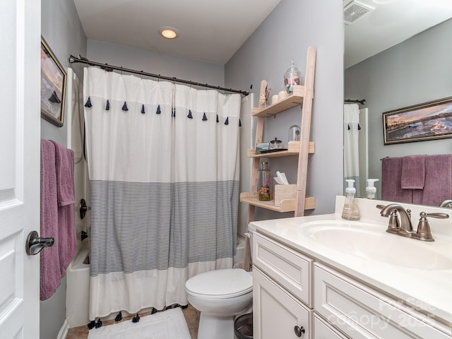 bathroom featuring visible vents, shower / bath combination with curtain, vanity, and toilet