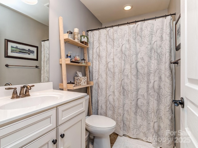 full bath with vanity and toilet