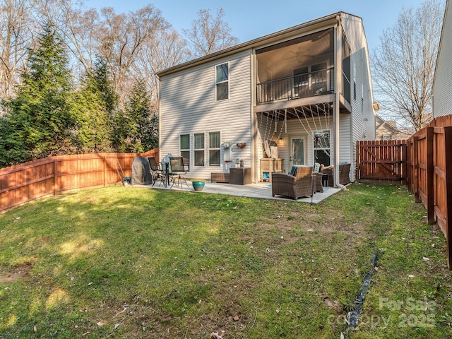 back of house featuring outdoor lounge area, a yard, a fenced backyard, a patio, and a gate