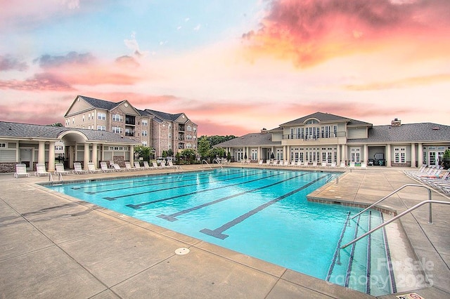 community pool with a patio area