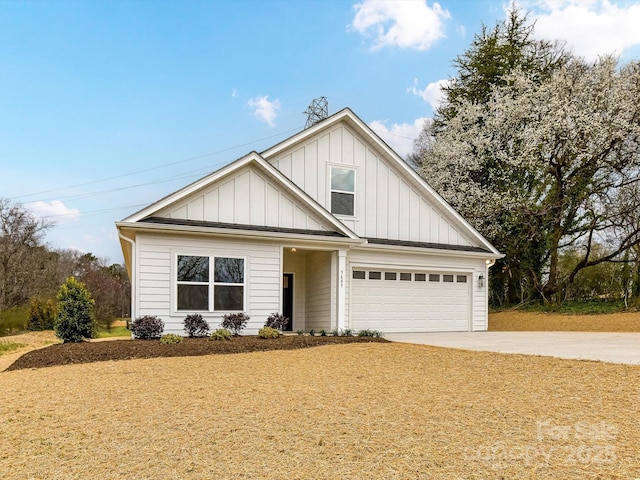 view of front of property featuring concrete driveway, a garage, and board and batten siding