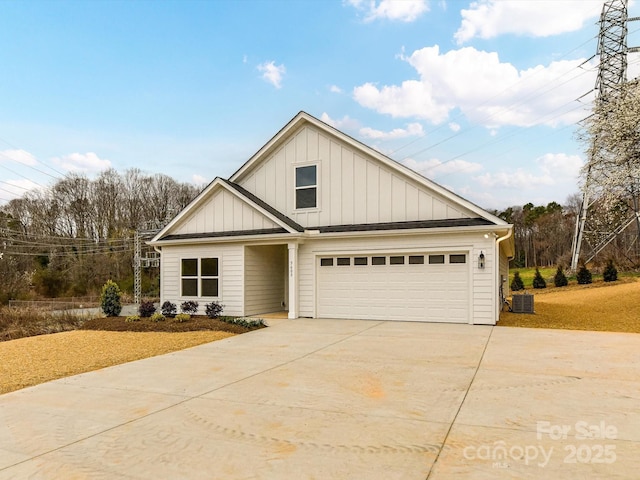 view of front of property with a garage, board and batten siding, and concrete driveway