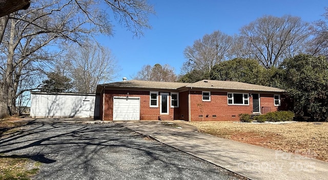 ranch-style home with crawl space, a garage, concrete driveway, and brick siding