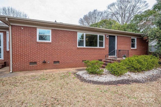 single story home featuring crawl space and brick siding