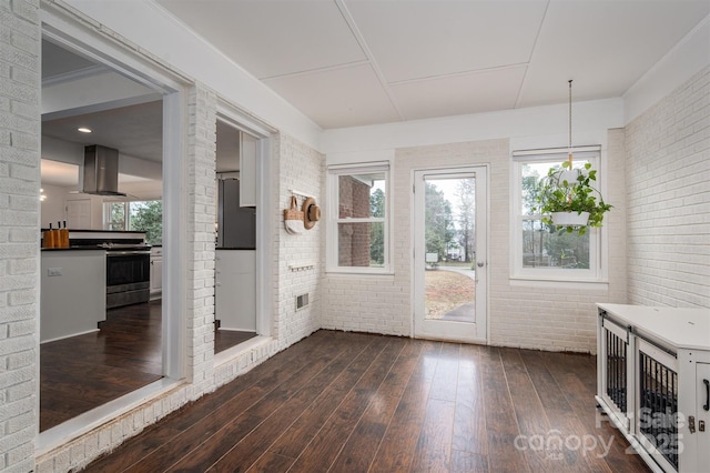 unfurnished sunroom with a wealth of natural light