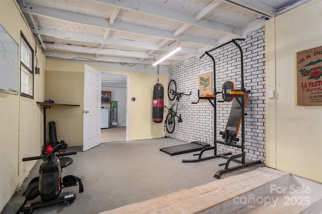 workout room with brick wall