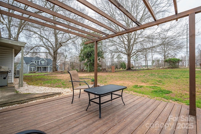 wooden terrace featuring a yard, a fenced backyard, and a pergola