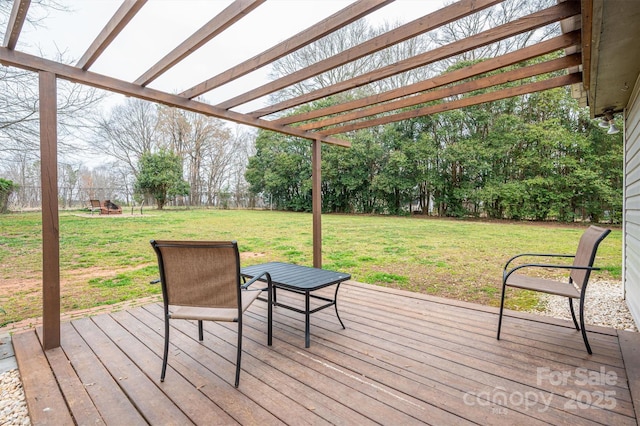 wooden terrace with a fenced backyard, a pergola, and a yard