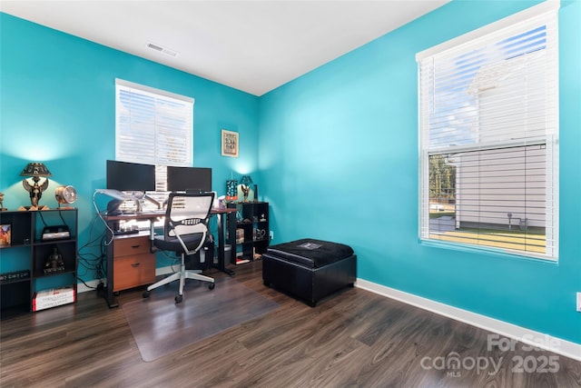 office with visible vents, baseboards, and wood finished floors