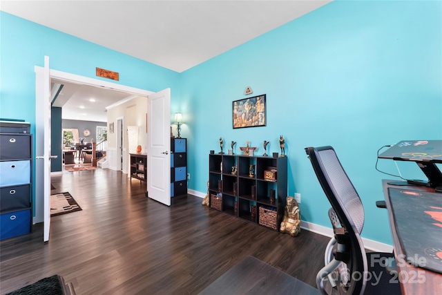 home office with wood finished floors and baseboards