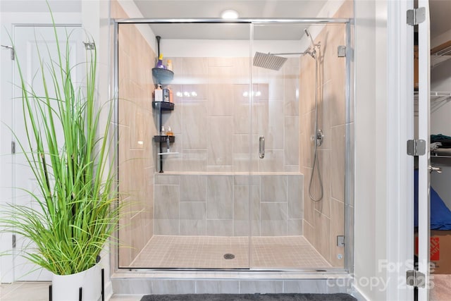 full bathroom featuring a shower stall