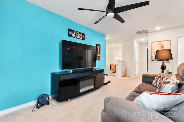 living area featuring baseboards, visible vents, carpet floors, recessed lighting, and ceiling fan