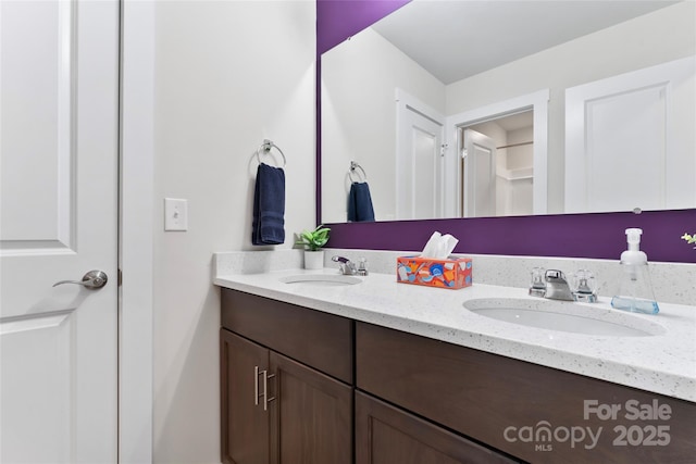 bathroom with double vanity and a sink