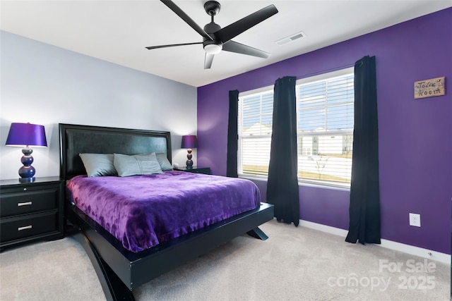 bedroom with light carpet, visible vents, ceiling fan, and baseboards