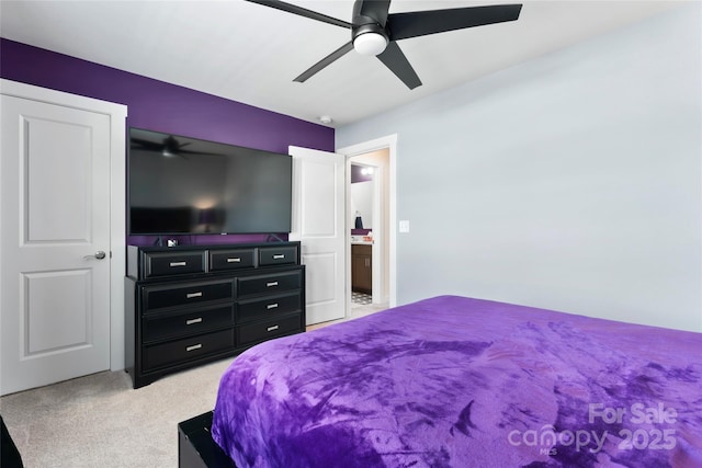 bedroom with light carpet and a ceiling fan