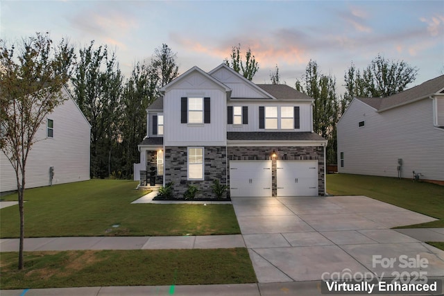 view of front of home with board and batten siding, a front yard, a garage, stone siding, and driveway