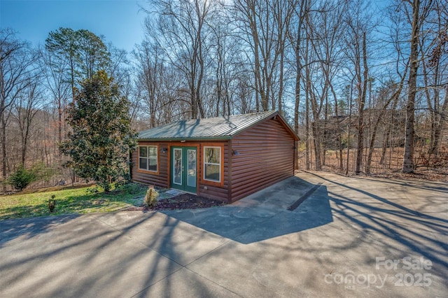 view of outbuilding featuring french doors