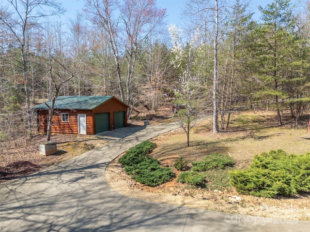 exterior space featuring aphalt driveway