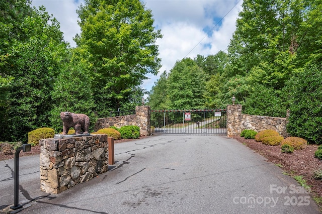 exterior space featuring a gate