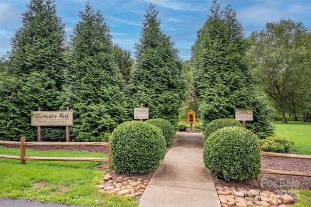 view of property's community with a lawn
