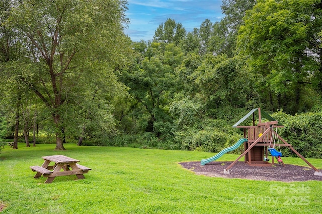 view of playground featuring a lawn