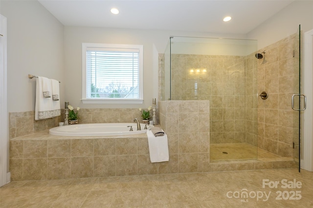 bathroom featuring tile patterned floors, recessed lighting, a shower stall, and a garden tub