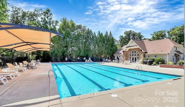 pool with a patio