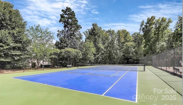 view of sport court with fence