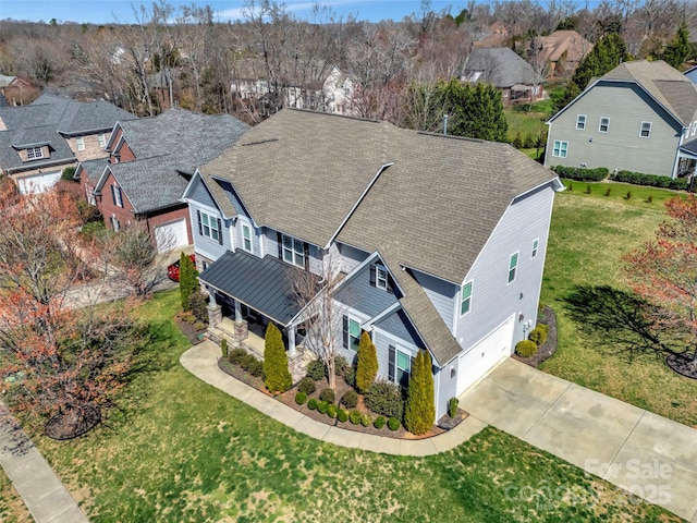 birds eye view of property with a residential view